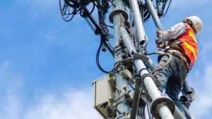 Telecommunications-worker-checks-lines._0
